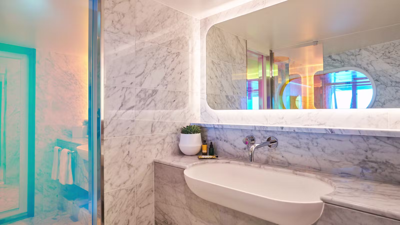 Seriously Suite marble bathroom and illuminated vanity