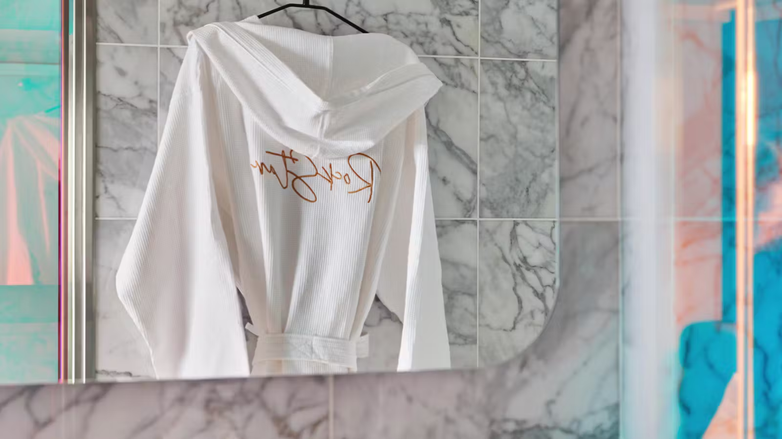 Seriously Suite robe displayed in the marble bathroom